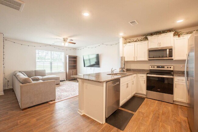 Building Photo - Partially furnished and now available!