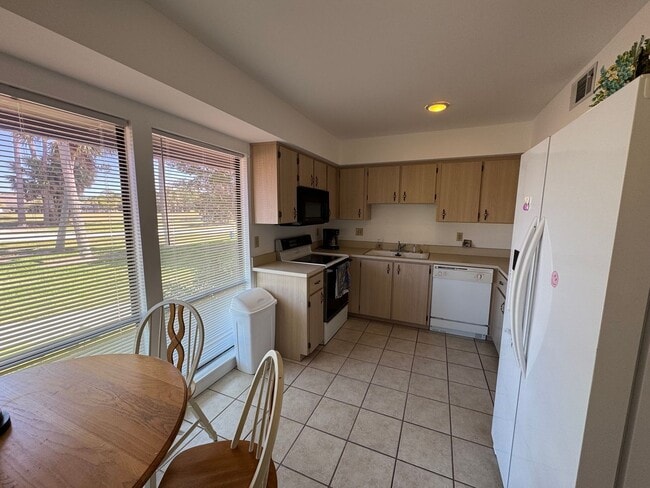 Building Photo - FULLY FURNISHED 2-Story Townhouse on Canal – Pool, Golf Views & ALL Utilities Included!