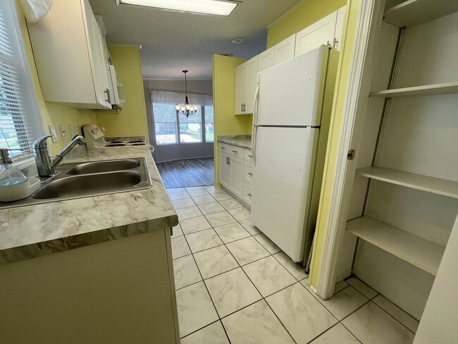 Building Photo - 2 BR 2 BATH Annual Rental in Barefoot Bay Available JUNE 2025