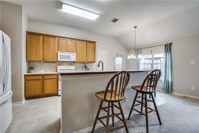 Building Photo - Darling 1 story 3 Bedroom home 2 car garage