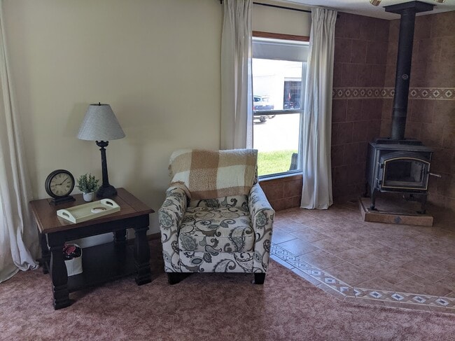 Living room with wood stove - 1012 3rd St