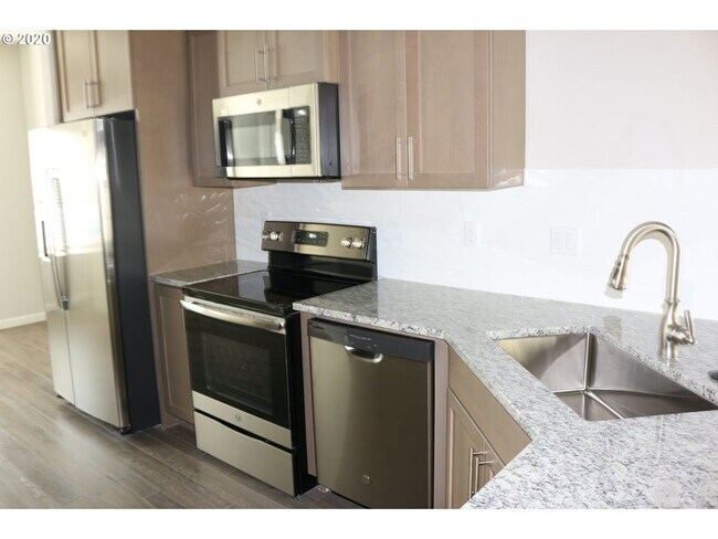 Building Photo - Modern 3-Bedroom Townhome-Style Home with Attached Garage, Private Patio & En-Suite Bathrooms in ...