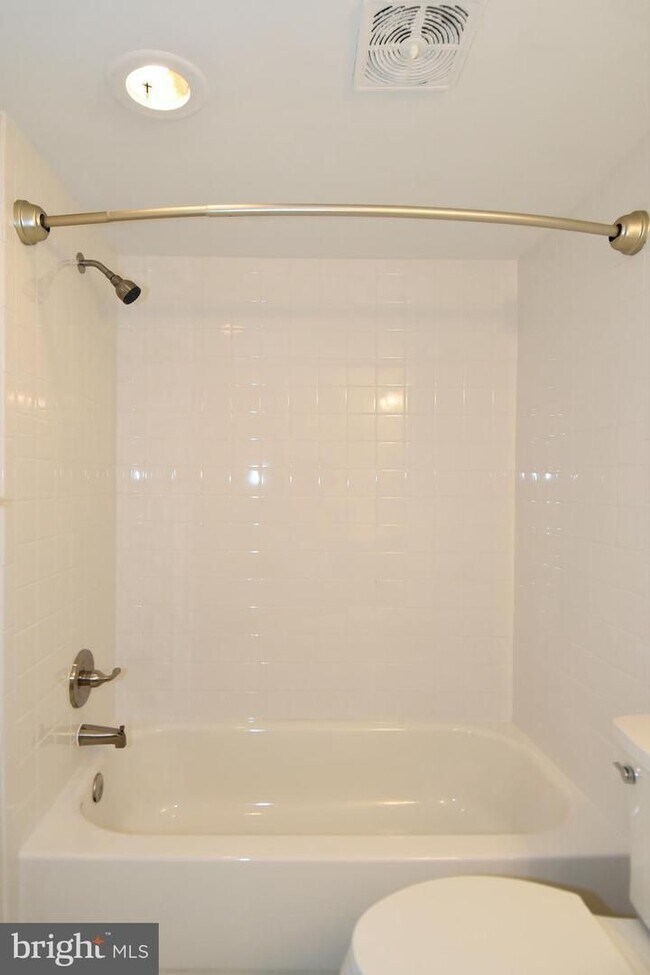 Building Photo - Commuter friendly location has easy access to I495 & Route 50. Metro bus stop in community.