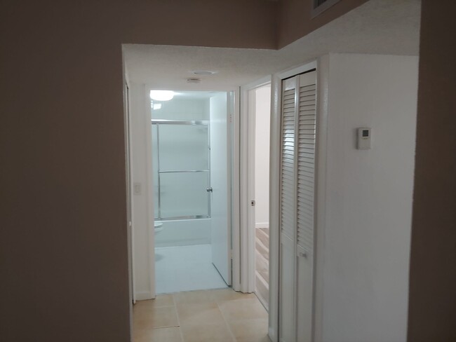 Hallway to bathroom and second bedroom - 6130 W 21st Ct