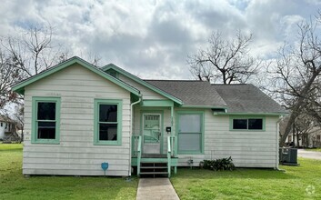 Building Photo - Spacious home with room to play outdoors.