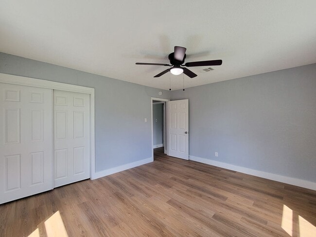 Building Photo - This beautifully updated 4-bedroom home is just under two miles from Highway 288 and Loop 610, ma...