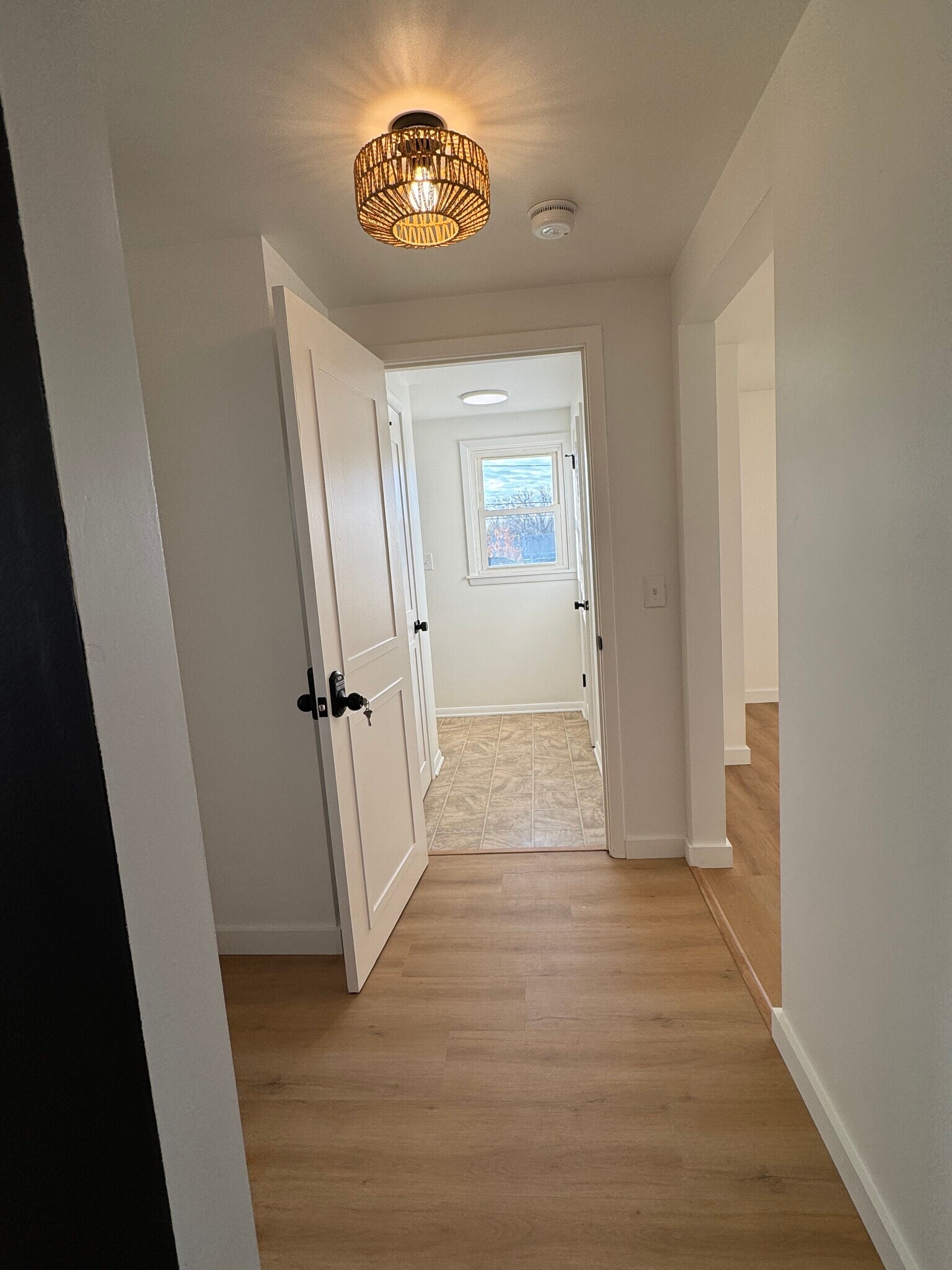 Hallway looking into livingroom and apartment entrance - 249 Dunlop Ave
