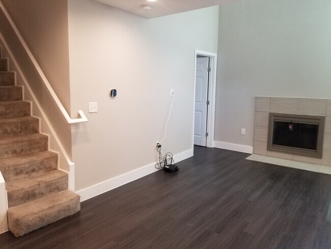 On one side of the living area is the entrance to the downstairs bedroom. - 935 La Posada Dr