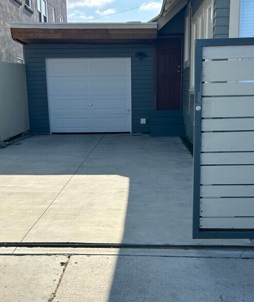 driveway enclosed for secured additional parking! - 642 E 10th St