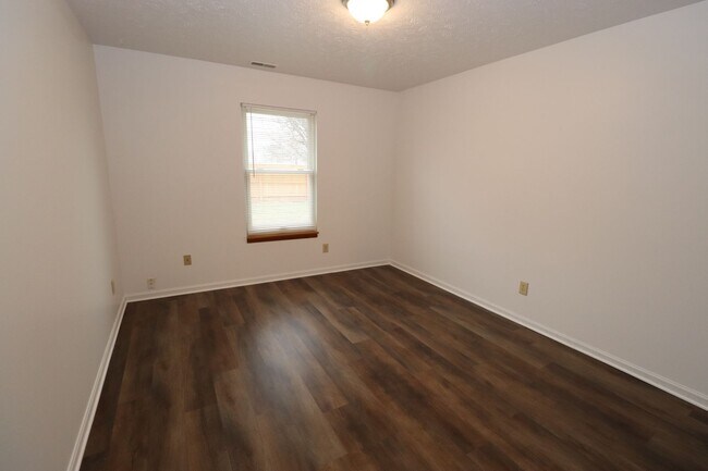 Building Photo - Discover this well-maintained 3-bedroom, 2-bath home in Indianapolis featuring an attached garage...