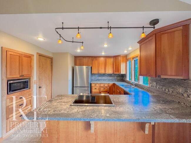 Building Photo - Vaulted 2-Bed Home with Scenic Views, Gas Fireplace & Oversized Deck