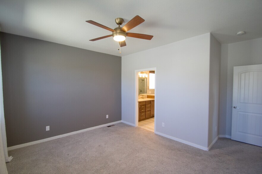 Primary bedroom with attached bath - 1810 Volterra Way