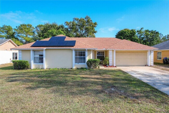 Building Photo - 3 bedroom 2 bath home with solar panels, workshop, large backyard and Florida Room!