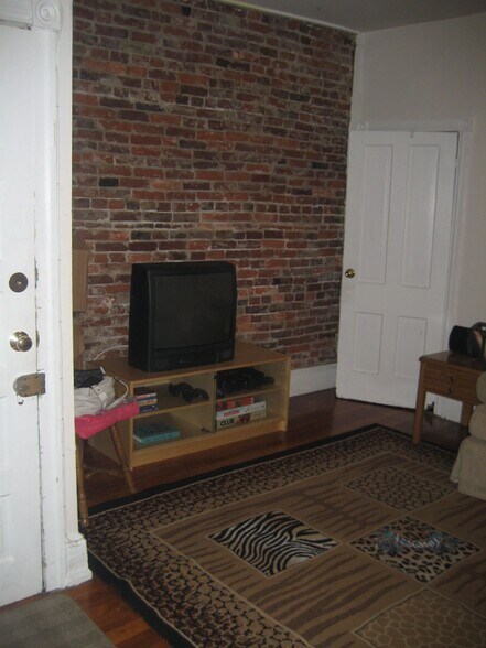 LR wall exposed brick - 745 S 4th St
