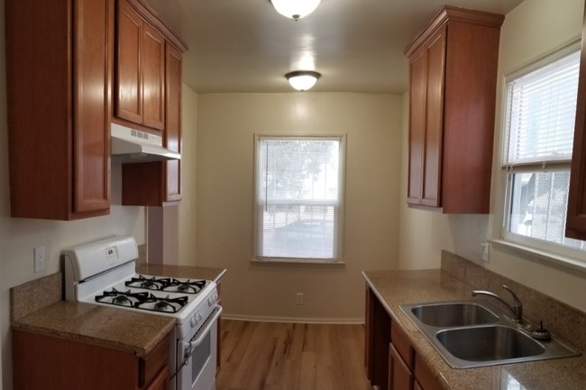 Kitchen with window allowing natural sunlight - 3780 Cimarron St