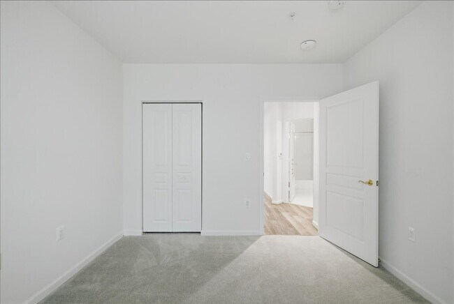 Building Photo - Commuter’s Paradise! Ground-Level 2BR Condo  Welcome home to this stunning, sun-filled 2-bedroom ...
