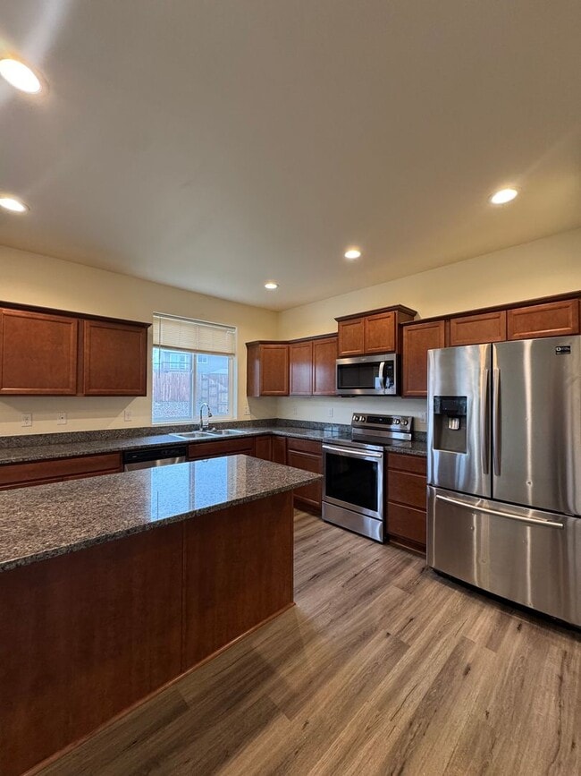 Building Photo - Spacious 5-Bedroom Home with Fenced Yard & Oversized Garage