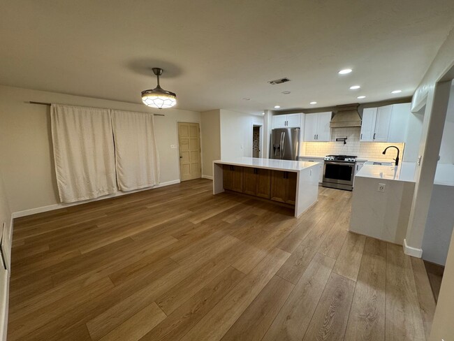 Building Photo - Beautifully Remodeled Home With Front & Si...