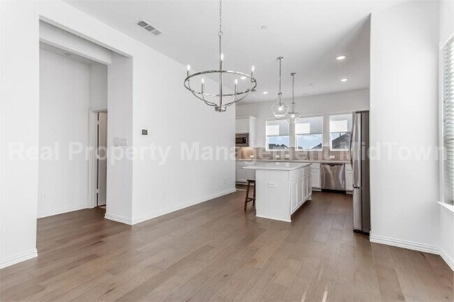 Building Photo - Live Elevated in the Heart of Viridian – S...