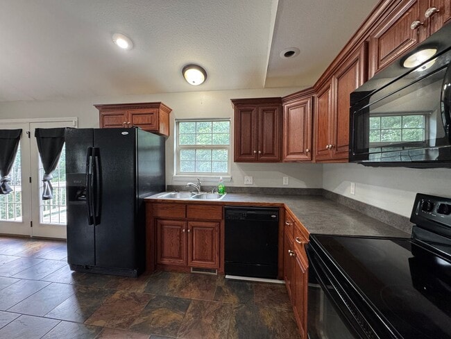 Building Photo - Well Maintained 4 Bedroom with a Privacy F...