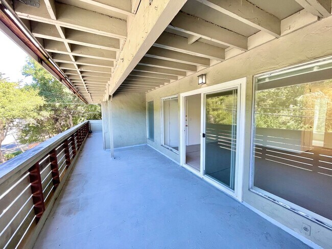 Building Photo - Sunlit 2BD/1BA w/ Private Balcony + Backyard! New Carpet! Assigned Parking! PROGRESSIVE
