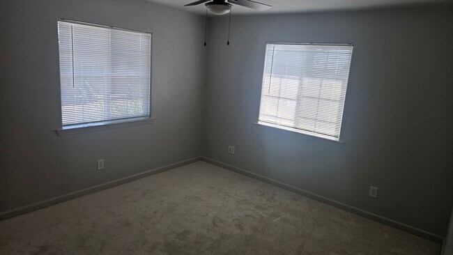 Building Photo - Three Bedroom Two and a half bath house, 2 car garage, central air. Available now.