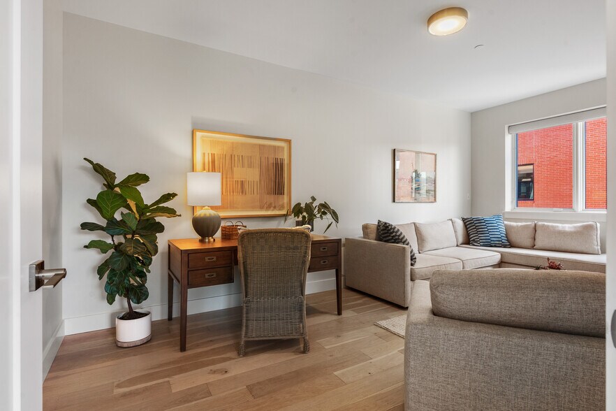 oversized den with Pottery Barn HUGE desk, Pottery Barn QUEEN sleeper sofa, flatscreen, elec. shades - 383 Commercial St