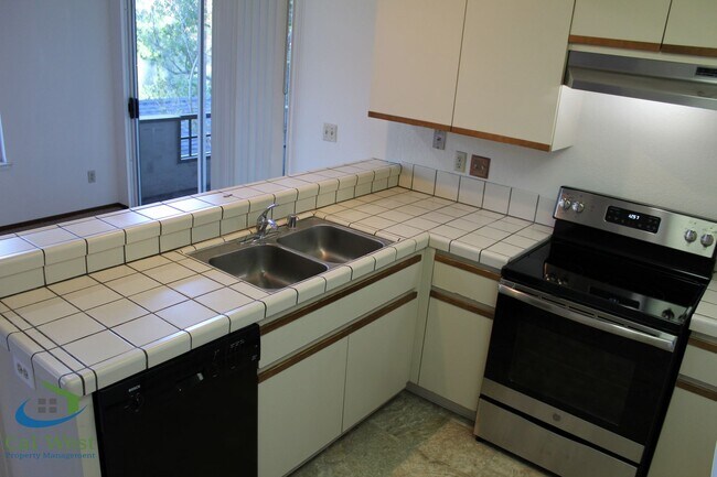 Building Photo - $2,895 - Upstairs 2 Bedroom/1 Bath Condo