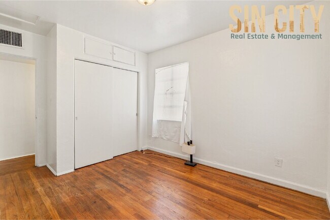 Building Photo - "Charming 1-Bed Duplex with Hardwood Elegance in Downtown Las Vegas!"