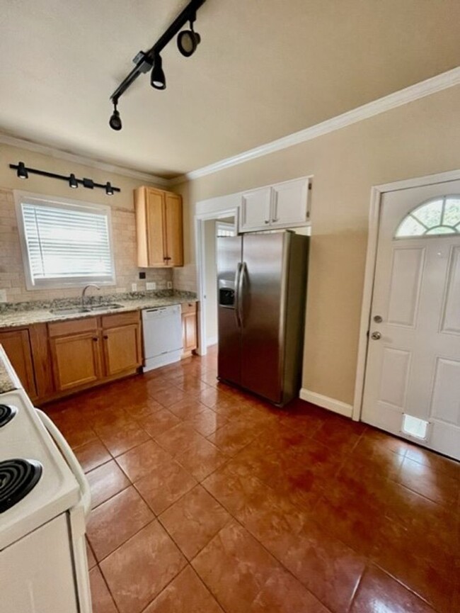 Building Photo - Introducing WesleyHeights401, a charming 3...