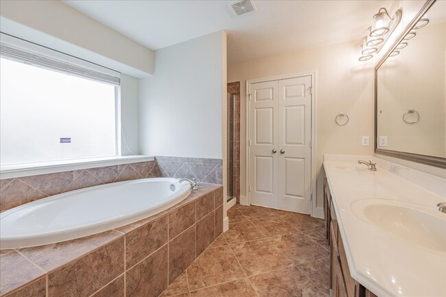 Primary Bathroom with Garden Tub - 5604 Balmorhea Dr