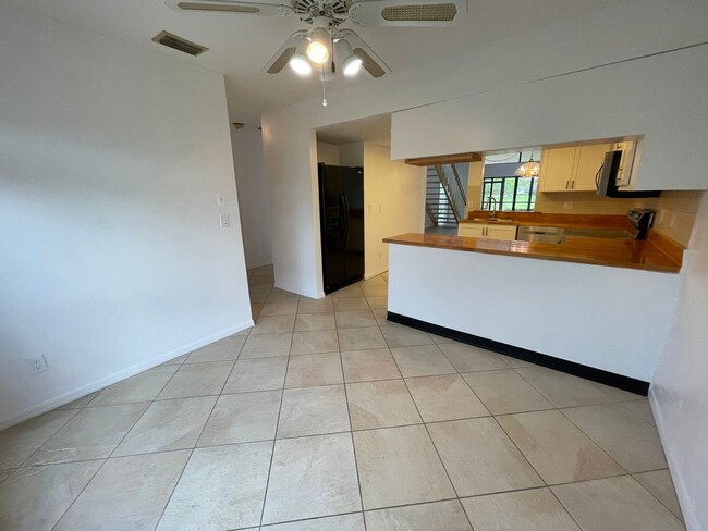 Building Photo - ANNUAL RENTAL - 2 + DEN / 2 BATH VILLA AT ...