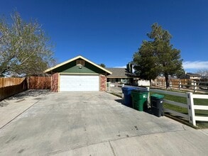 Building Photo - Your Dream Home: Spacious Interiors, Garage, and Huge Backyard