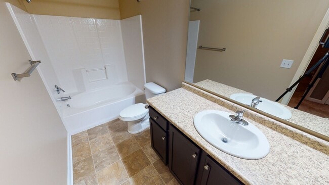 Building Photo - 3-Bedroom Ground-Level Unit with Rear View in Gated Community – Stair Access Required