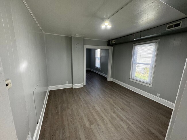 Building Photo - Interested in a two-bedroom house that includes a large garage. Please let us know
