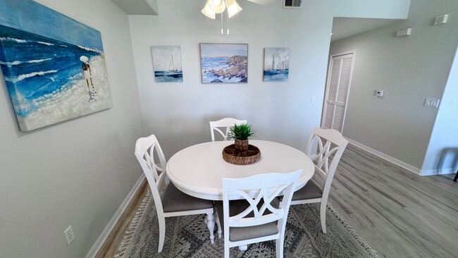 Building Photo - Elevated Luxury at The Terraces – 4th Floor Lake & Golf Course Views! 55+ Community!