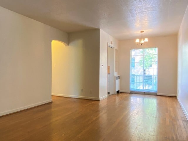 One Bedroom Living Room & Dining Area - Elite Court Apartments