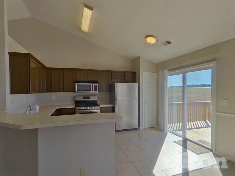 Building Photo - 7955 Streamside Ln