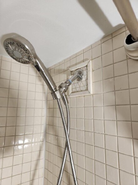 New tile & shower head - 1301 N Ode St