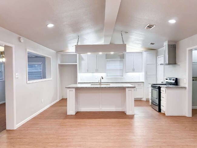 Building Photo - Spacious Living & Modern Upgrades