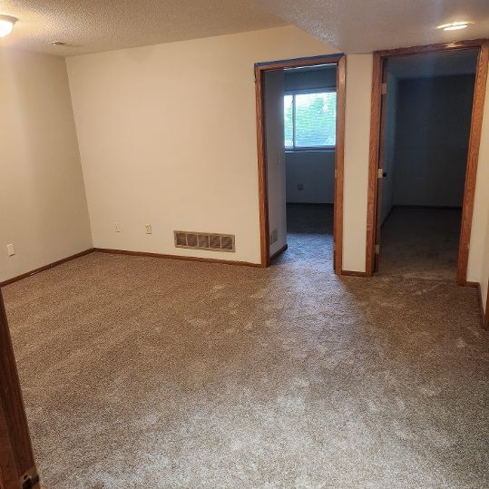 Lower level family room showing bedroom placement - 2050 Bradley St