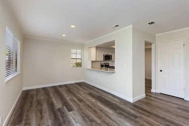 Building Photo - Upgraded La Costa Townhome