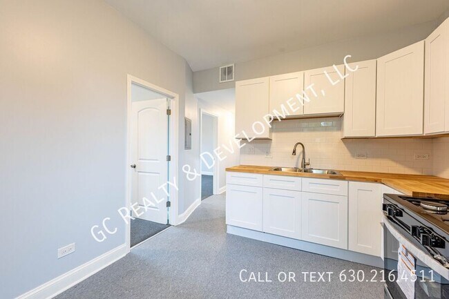 Building Photo - 6433 S Vernon Ave