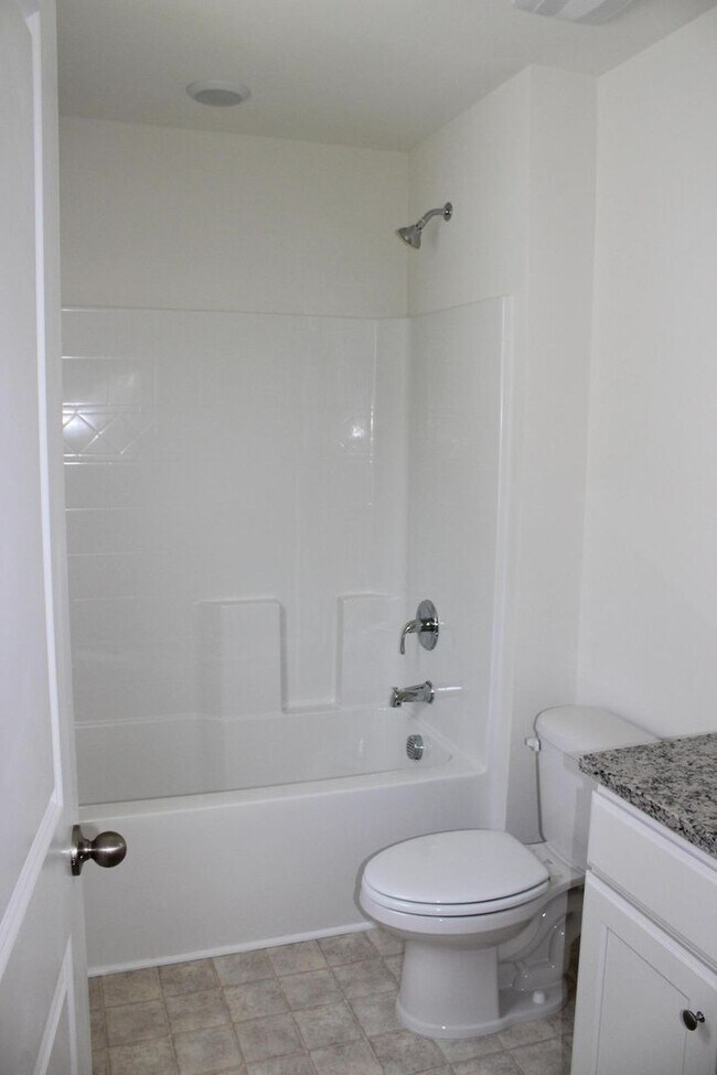 Building Photo - Sun-Filled 3-Story End-Unit Townhome with Fenced Yard, Storage & Resort-Style Pool