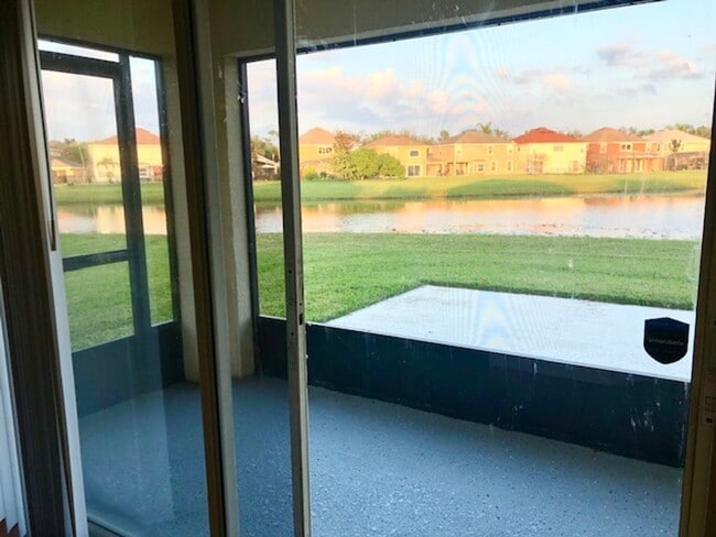 Building Photo - EAGLE CREEK LAKE NONA! WELCOME HOME! Beautiful water views! Spacious 2 story-3 bedroom 2.5 bath h...