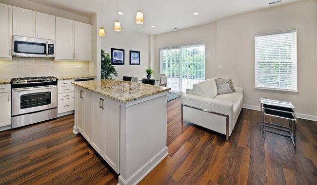 Madison townhome kitchen features breakfast bar - Elm Creek Apartments