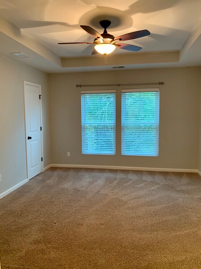 Large master with tray ceiling and fan - 1545 Oldenburg Dr