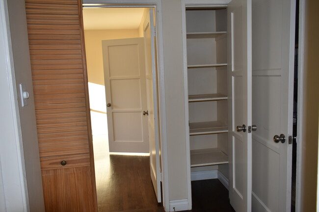 Hallway closet next to laundry for linens & things - 1438 S Sherbourne Dr