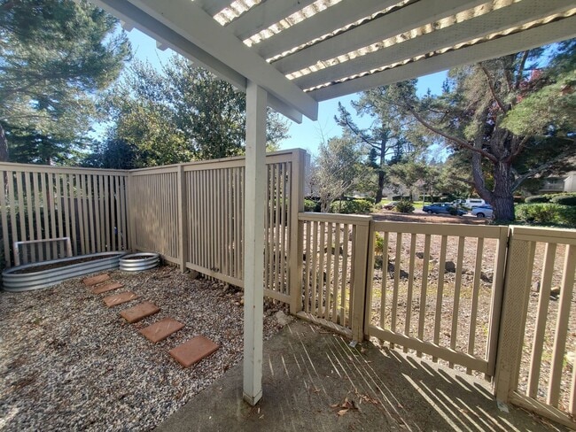 Building Photo - Private 2x2 Santa Rosa Townhouse with pool, 2-car garage, workshop area, fireplace, W/D Hookups