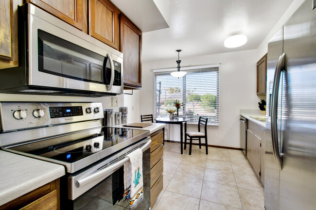 Samsung range and microwave. Enjoy beautiful desert views while cooking or baking. - 12414 W Nugget Ct